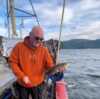 Man holding the catch of. the day